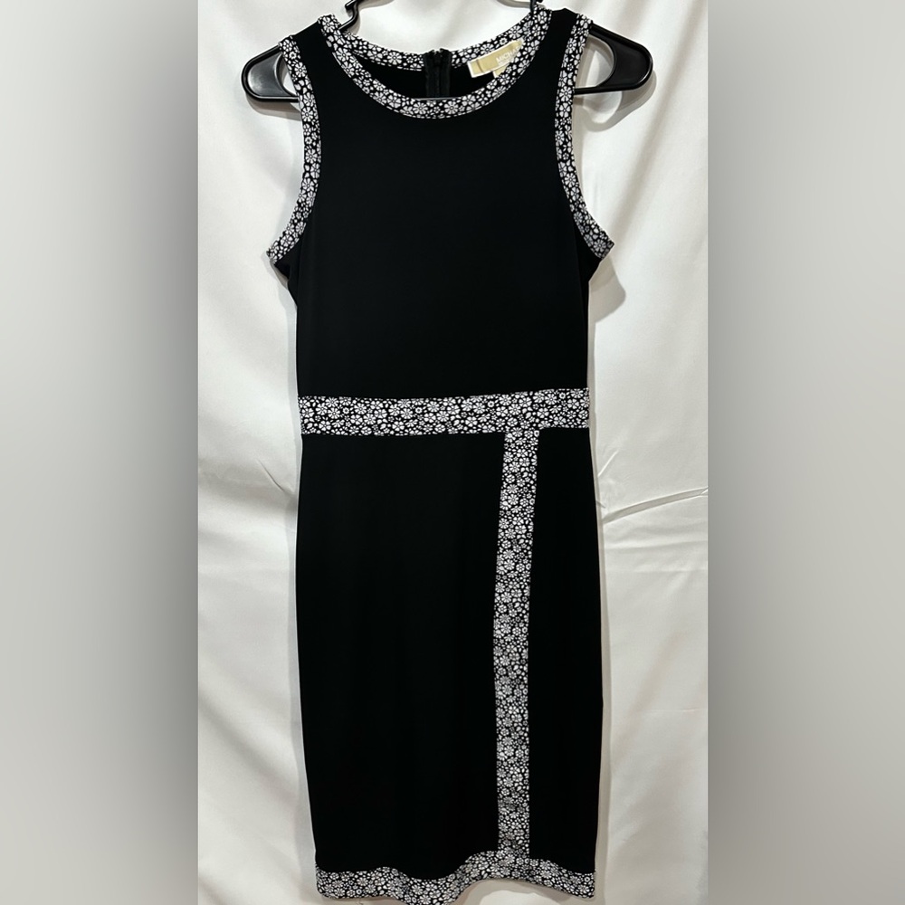 Michael Kors black midlength dress with black and white floral alignment.